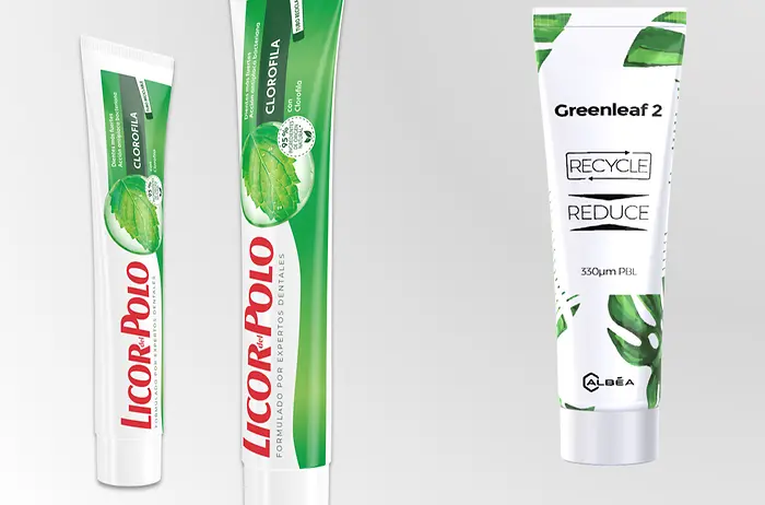 Recyclable toothpaste tubes lined up next to each other.