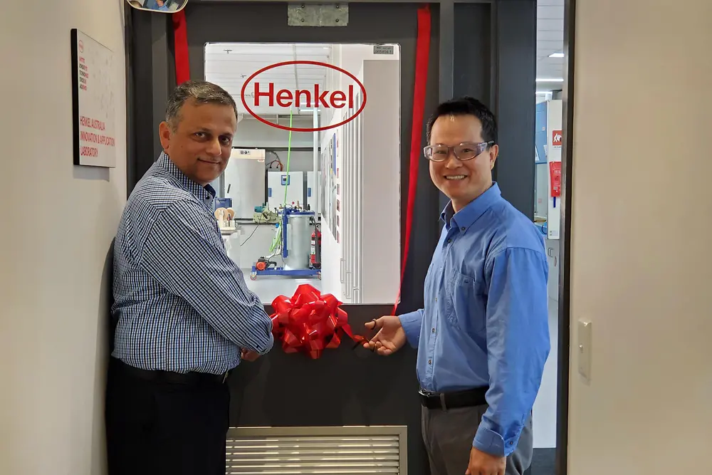 Aamir Qureshi (left), Operations & Supply Chain Manager, and Stephen Liu (right), Senior Chemist, cutting the ribbon to mark the official opening of the upgraded Innovation and Application Lab of Adhesive Technologies in Sydney.