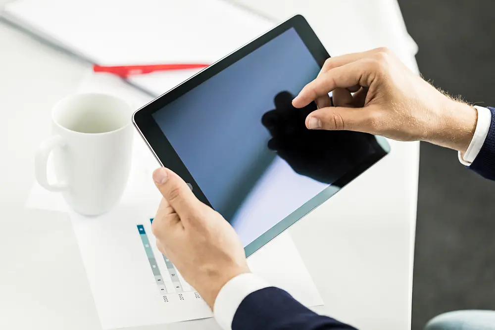 Person holding a tablet